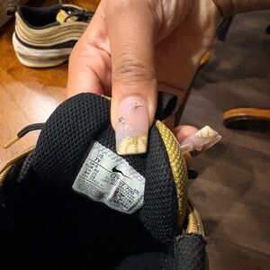 Nike Black and Gold Athletic Shoes